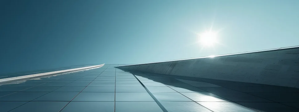 a modern, sleek rooftop adorned with solar panels under a clear blue sky.