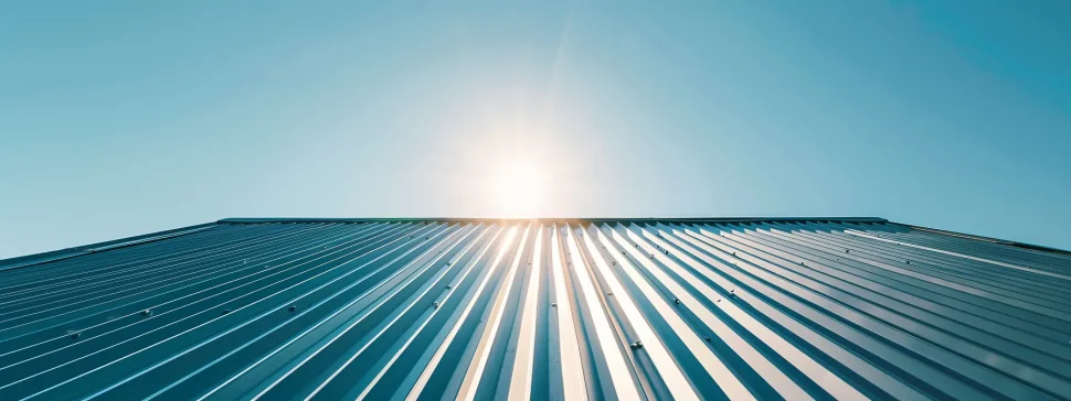 a sturdy, weather-resistant metal roof shimmering under the bright sun.